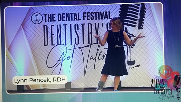 Lynn Pencek giving a seminar at dental festival.